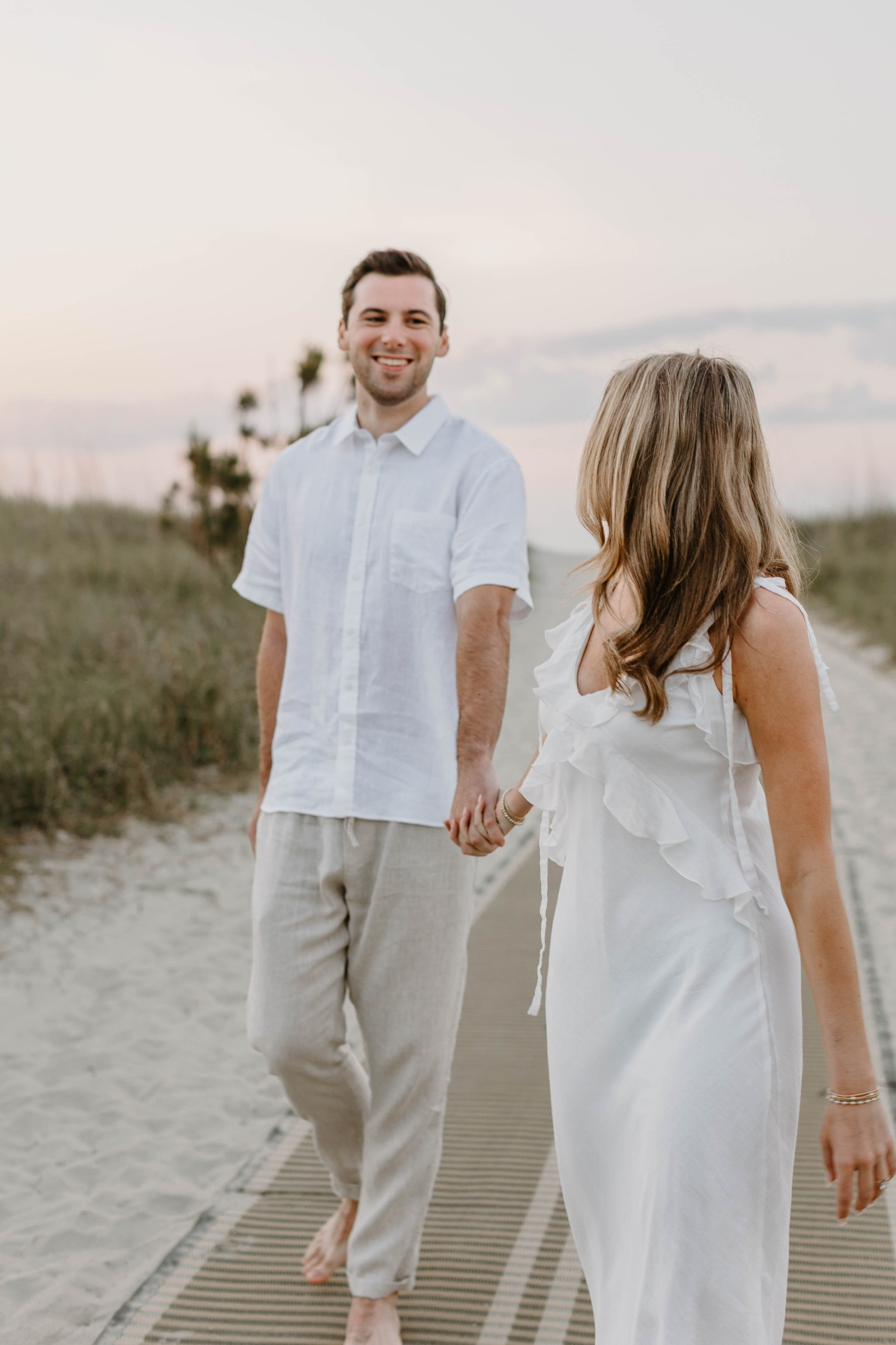 Bryce and Kayleigh walking on the beach