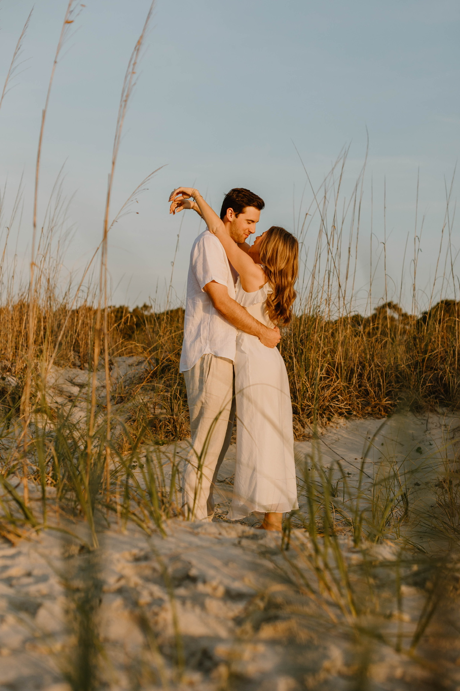 Bryce and Kayleigh dancing in the dunes